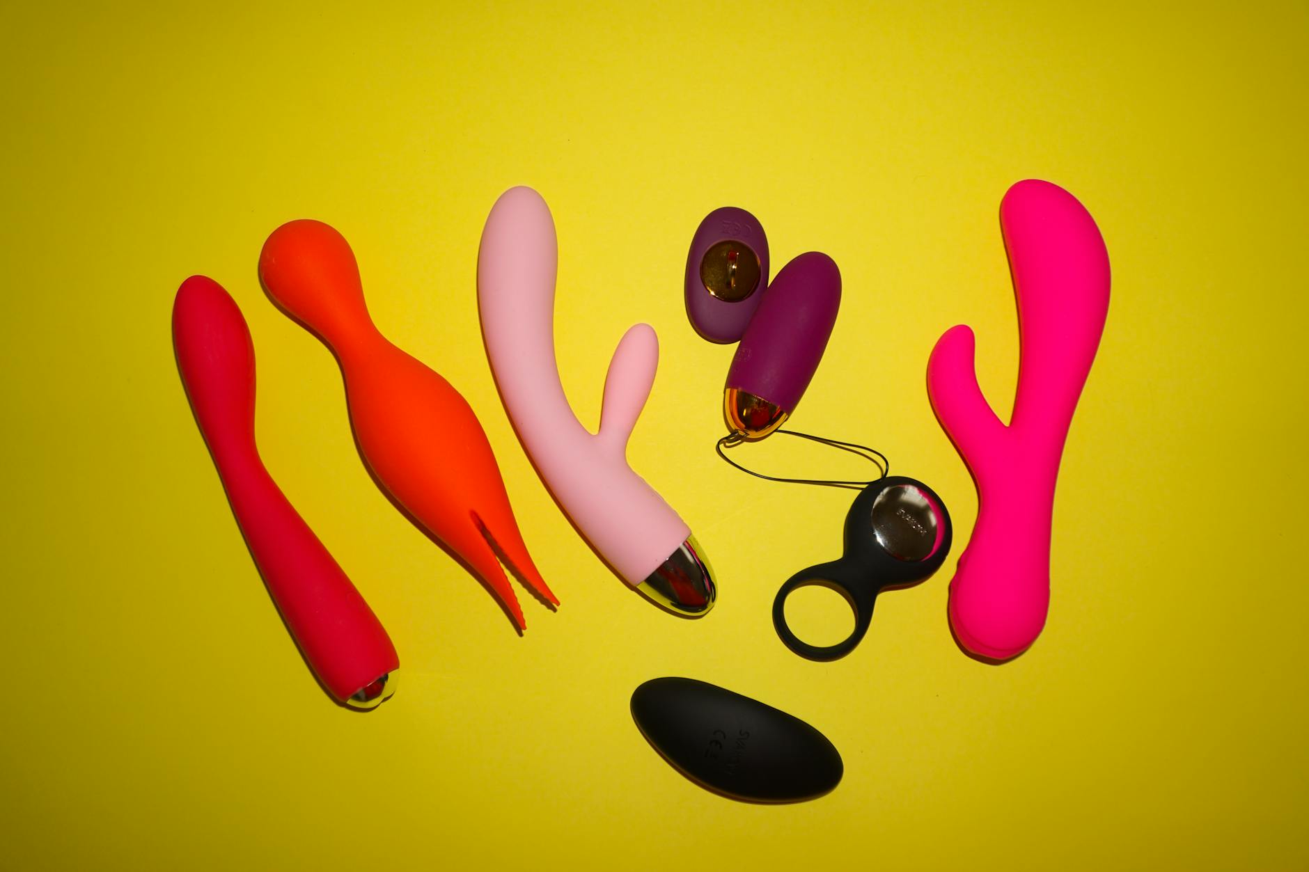 Hands holding a gentle personal massager against soft knitwear